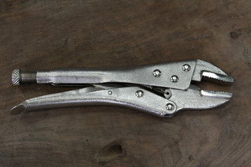 Locking pliers on the table.