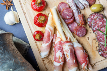 mix of spanish salami with vegetables and olives