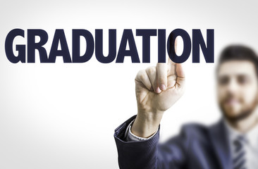 Business man pointing the text: Graduation