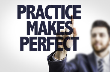 Business man pointing the text: Practice Makes Perfect