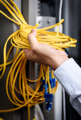 men hand hold fiber optic cable