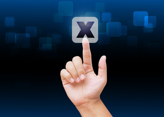 Hand pressing cross mark buttons with technology background