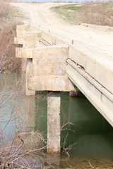 Fototapeta na wymiar concrete bridge over a small river