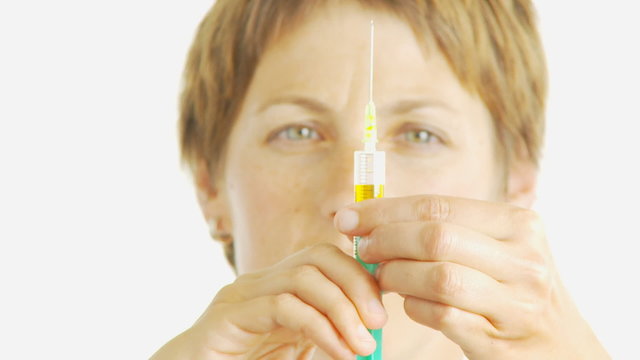 female doctor preparing injection