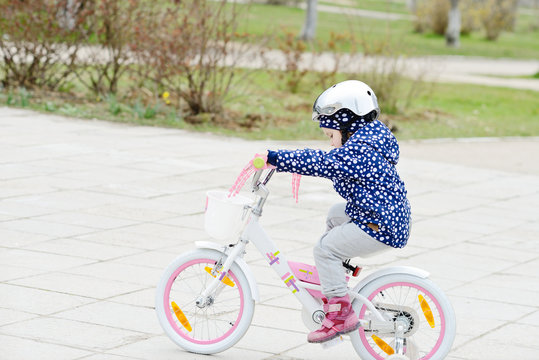 Little girl riding a bicycle