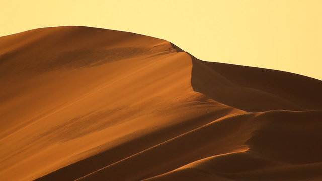 dunes in desert with wind closer
