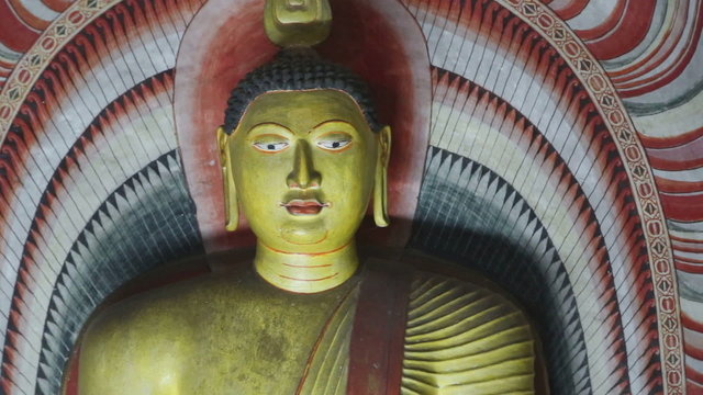 DAMBULLA, SRI LANKA - FEBRUARY 2014: Close up view of sitting Buddha at the Golden Temple of Dambulla. The Golden Temple of Dambulla is a World Heritage Site in Sri Lanka.