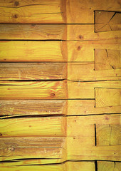 Yellow wall of wooden beams