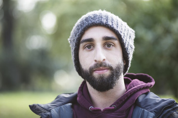 Portrait of trendy guy in the park