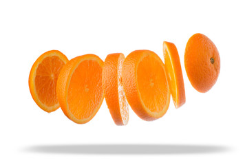 Falling slices of orange in air isolated on white