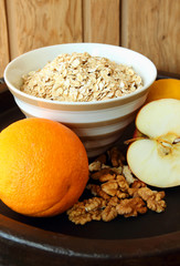 A plate of oatmeal and fruit.