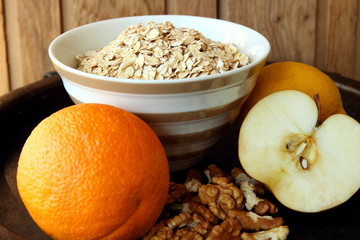 A plate of oatmeal and fruit.