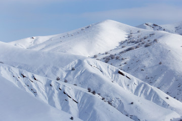 Fototapeta na wymiar snowy slopes of the Tien Shan Mountains