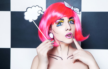 Surprised woman with a talk bubble and comic make up