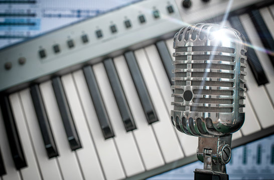 Retro microphone over piano and recording software background.