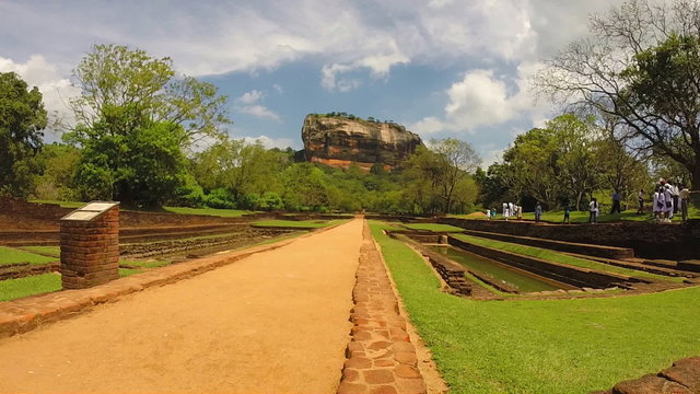SIGIRIYA, SRI LANKA - MARCH 2014: Timelapse view of people walking in park below from Sigiriya rock.