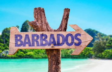 Barbados wooden sign with beach background