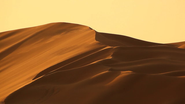 dunes in desert with wind