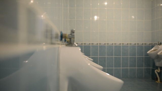 A man in a public toilet