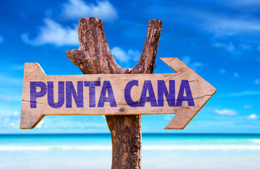 Punta Cana wooden sign with beach background