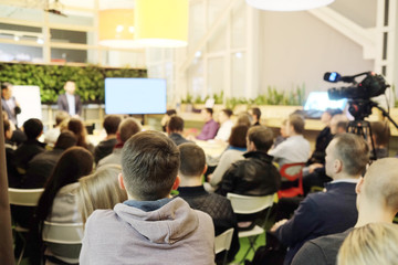 Meeting in a conference hall. Audience at the conference hall.