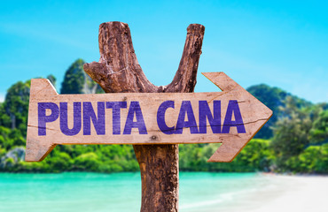Punta Cana wooden sign with beach background