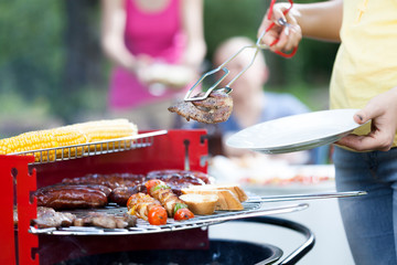 Woman dishing out tasty chuck steak