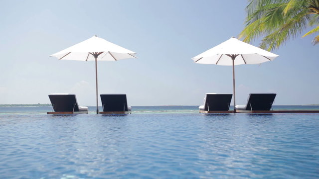 infinity pool with parasols