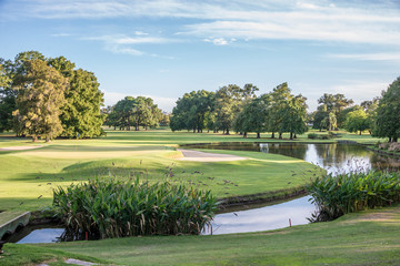 Green at sunset on a beautiful golf course.