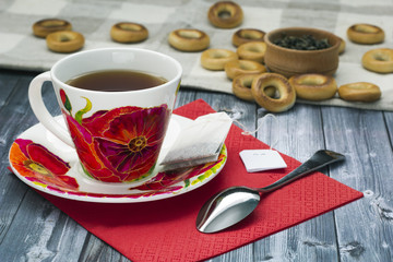 cup of tea and bagels with poppies