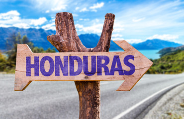 Honduras wooden sign with road background