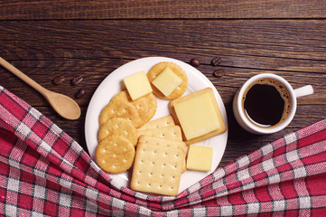 Coffee cup and crackers with cheese