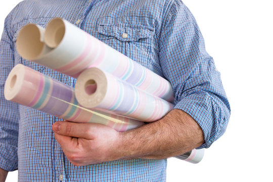 Handyman carrying rolls of wallpaper