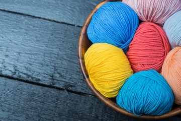 Colorful knitting yarn balls in basket