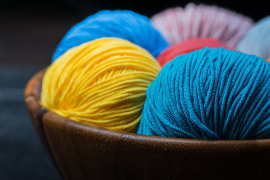 Colorful knitting yarn balls in basket