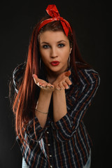 Woman with beauty long red hair - posing at studio
