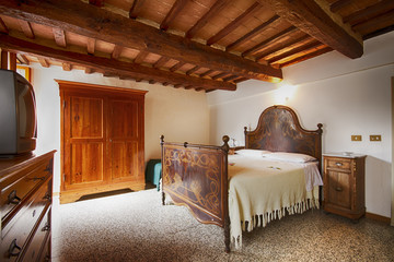 Bedroom with rustic wooden bed