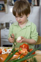 Cute Little Boy Trying Hard to Become a Great Chef