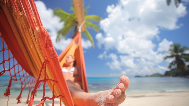woman in hammock with palmtree audio