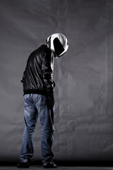 motorist with a helmet, leather jacket and jeans