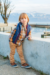 Outdoor portrait of a cute fashion little boy