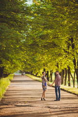 Fototapeta na wymiar Couple walking holding hands