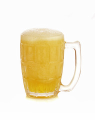 Mug fresh beer with cap of foam isolated on white background