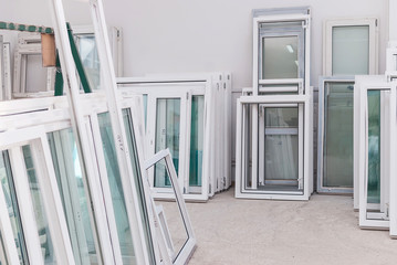 Set of PVC Windows in a Factory Interrior - obrazy, fototapety, plakaty