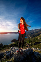 Obraz premium Sports woman on the top of mountain