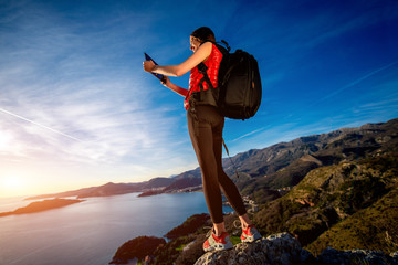 Sports woman on the top of mountain