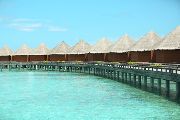 Fototapeta premium Water villas over blue ocean in baros Maldives