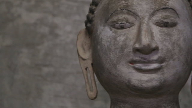 DAMBULLA, SRI LANKA - FEBRUARY 2014: Close up view of sitting Buddha at the Golden Temple of Dambulla. The Golden Temple of Dambulla is a World Heritage Site in Sri Lanka.