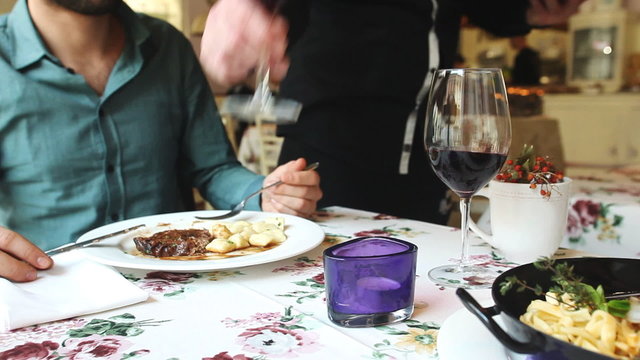 Waiter bringing wine