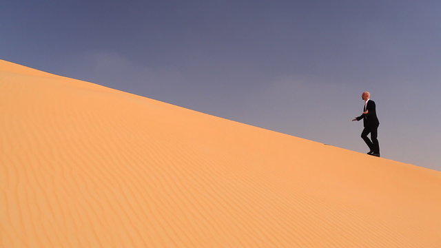 businessman in desert sand